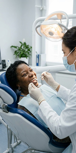 image of young woman receiving dental care