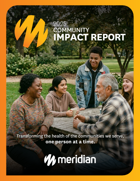 image of 2025 community impact report cover. Image of a group of people in a park at a picnic table and a subltitle that says transforming the health of the communities we serve, one person at a time.